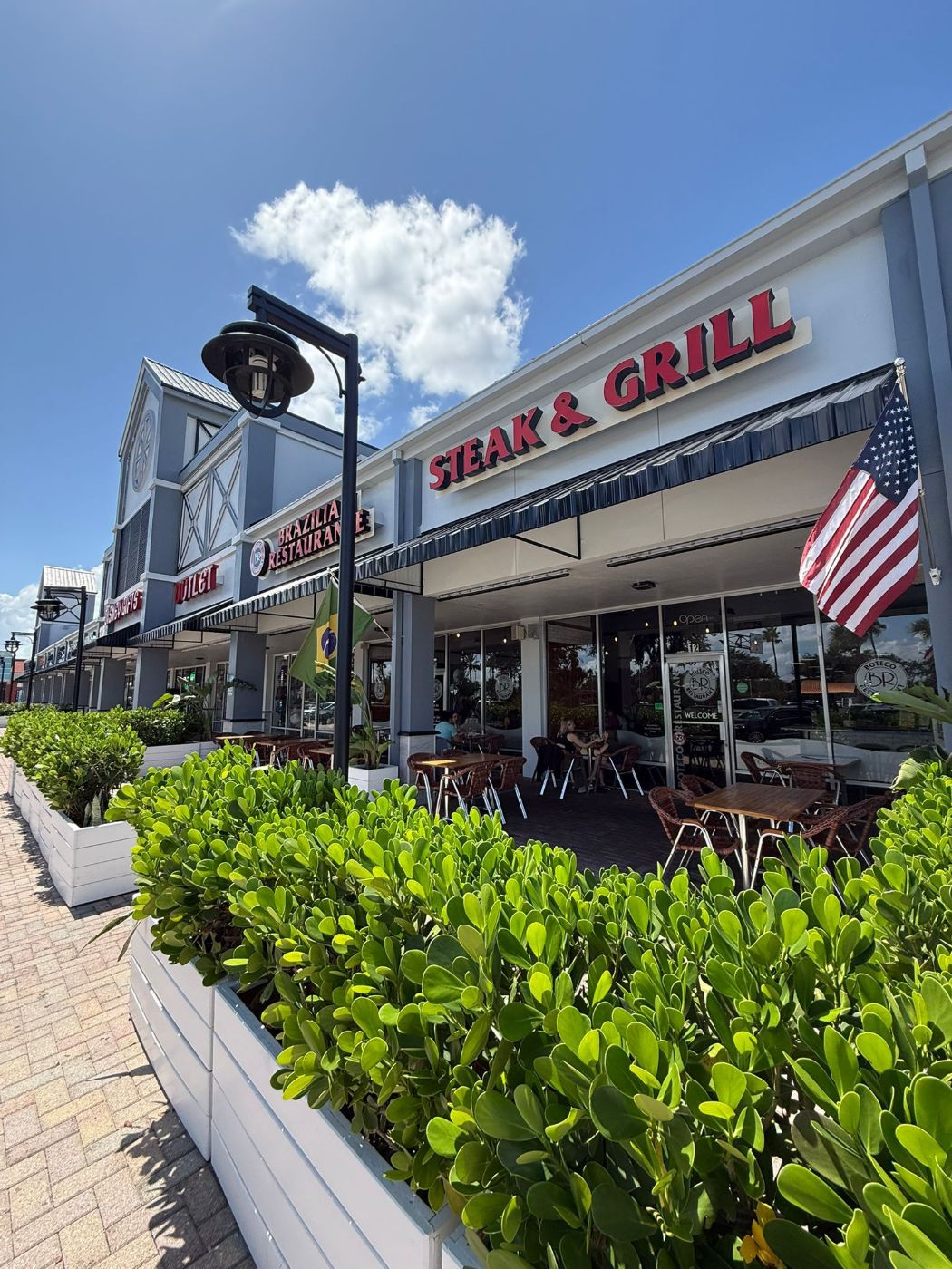 Outdoor patio seating at Boteco Restaurant